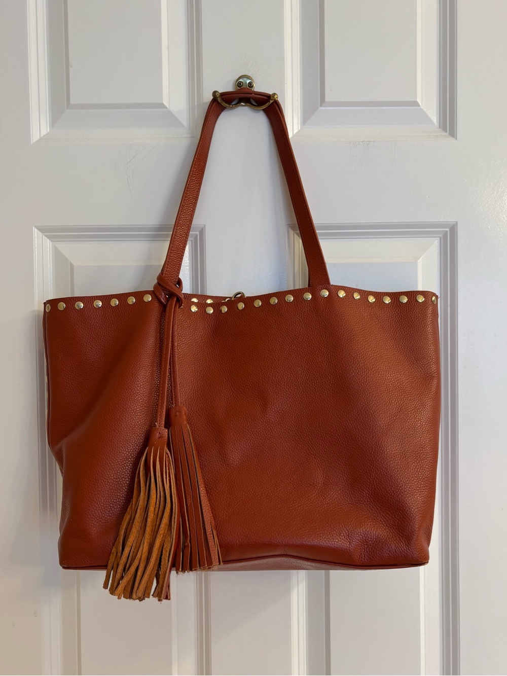 Laggo leather tote bag, featuring a distinctive hanging tassel and gold-tone stu